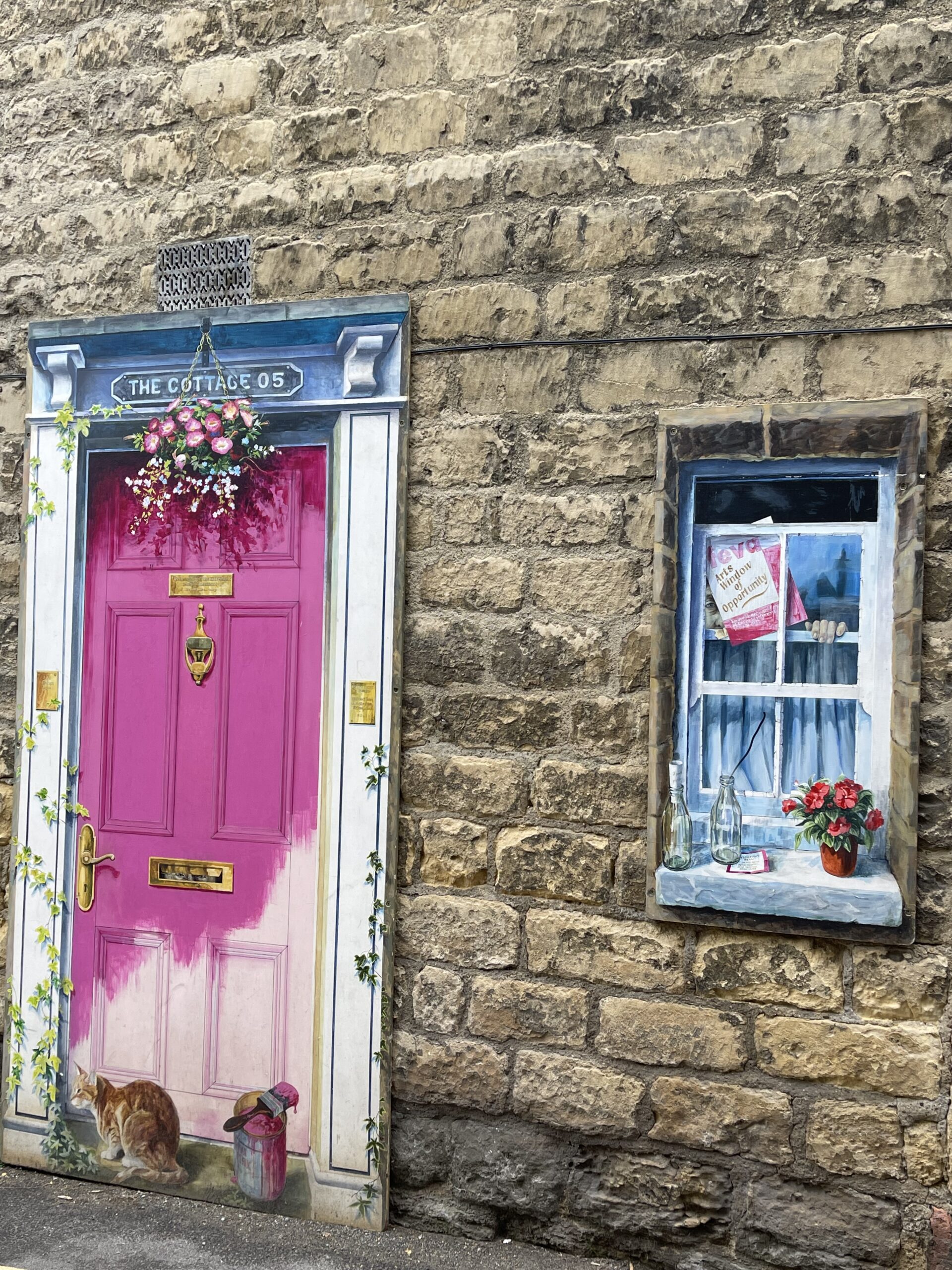 painted windows in Knaresborough town centre pink door and window