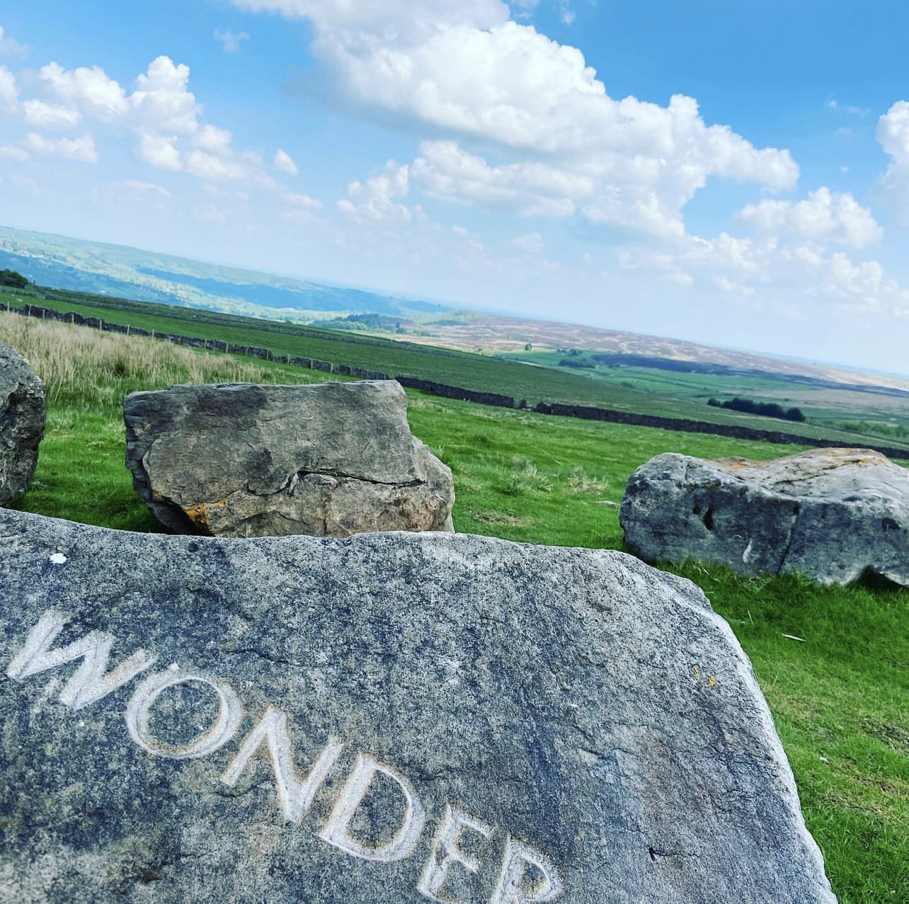 Rock engraved with the word wonder by Coldstone Cut